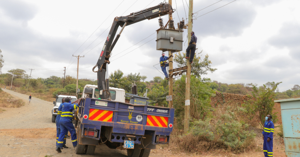 Kenya Power staff working on a transformer KPLC New Connection Application