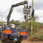 Kenya Power staff working on a transformer KPLC New Connection Application